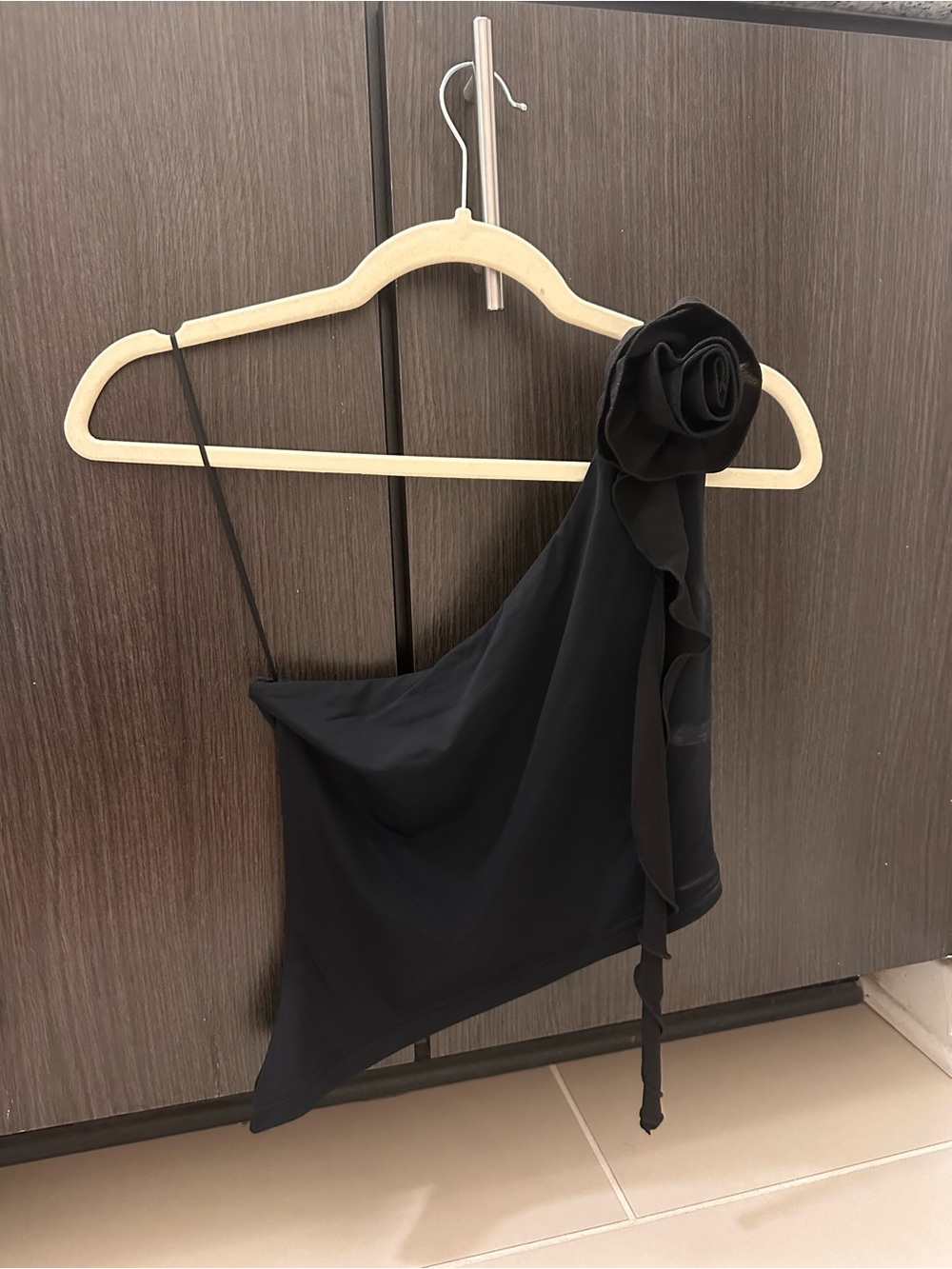 Black One-Shoulder Ruffle Top with Rosette Detail